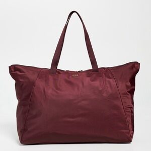BRAND NEW never used. Tumi packable tote bag. Burgundy.